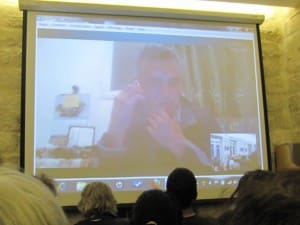 Emad Burnat in Bil'in talking to film audience in Jerusalem by Skype