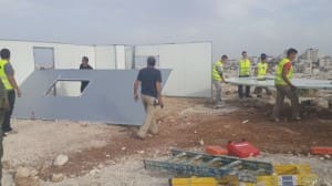 Caption: Israeli Civil Administration dismantling Bedouin homes funded by the European Union and France, 9 April 2014. Credit: ACF (Action Against Hunger) Project Officer