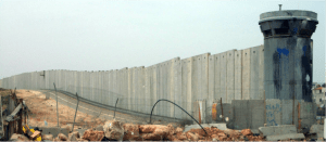 Israeli Annexation Wall at the Qalandia Checkpoint, the main access from the West Bank to East Jerusalem. Source: flickr